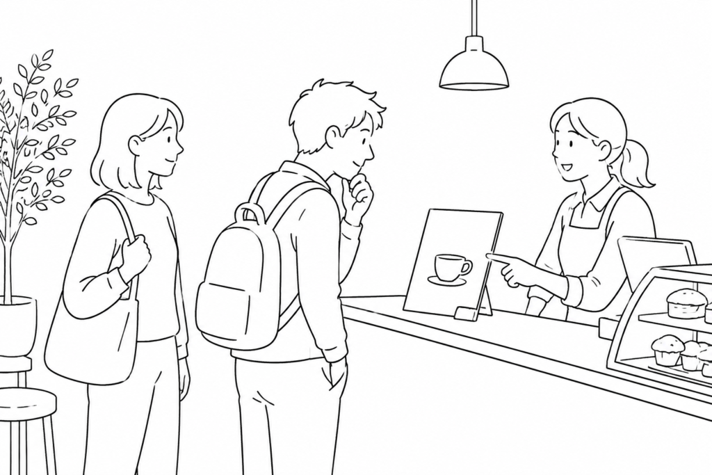 A traveler nods at the menu a server points to while a friend waits behind.